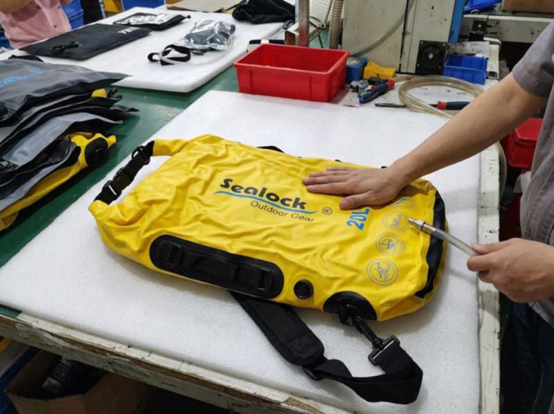 Kayak backpacks resting after vacuum extraction during a 24-hour air-leak check